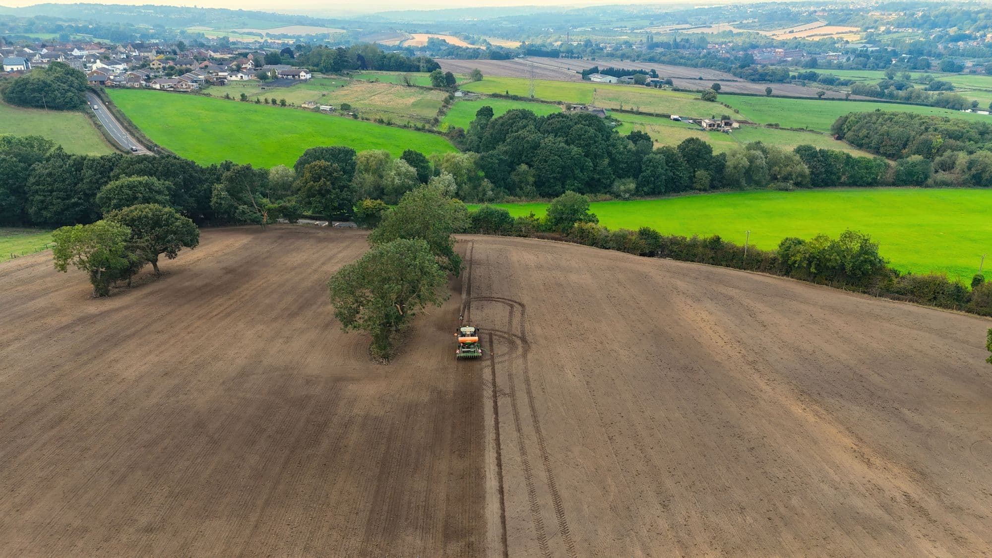 A tractor working a field in the Yorkshire countryside